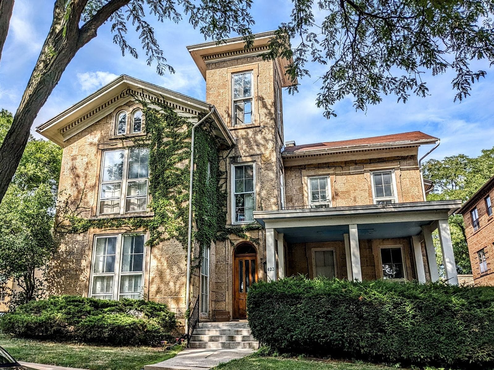 Historic Robert M. Bashford House featuring ivy-covered walls and a charming porch.