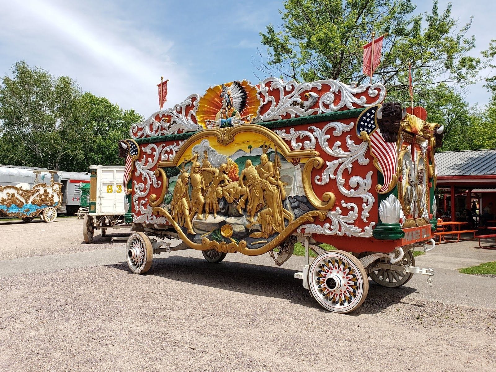Ornate, vintage circus wagon with colorful carvings and painted figures at Circus World in Baraboo, Wisconsin.